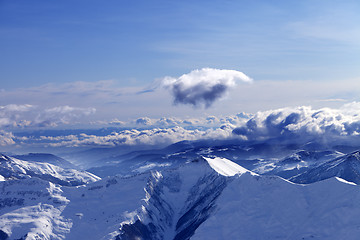 Image showing Winter mountains at nice evening and sunlight clouds