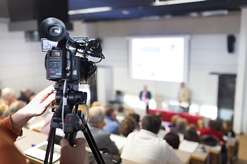 Image showing Television broadcasted press conference.