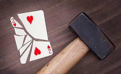 Image showing Hammer with a broken card, two of hearts