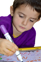 Image showing Young boy write