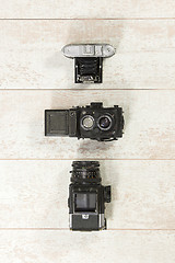 Image showing Retro Cameras With Flash On Floorboard