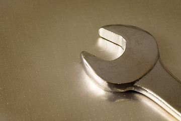 Image showing Wrench on metal surface

