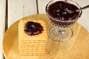 Image showing Some biscuits and blackberry jam