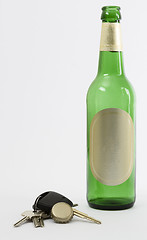 Image showing empty beer bottle with car key and crown cork