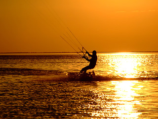 Image showing Silhouette of a kitesurf on a gulf on a sunset 2