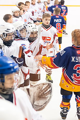 Image showing Child hockey. Greeting of players after game