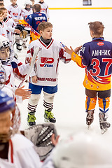 Image showing Child hockey. Greeting of players after game