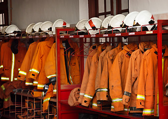 Image showing Firefighting Equipment Arranged on Racks at the Fire Station