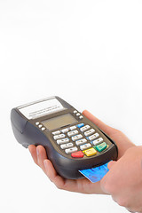 Image showing Male hand enters PIN code on payment terminal 