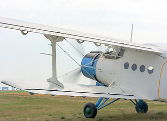 Image showing A fragment of an airplane AN2 with the engine running and the ro