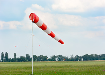 Image showing Windsock against cloudy sky.