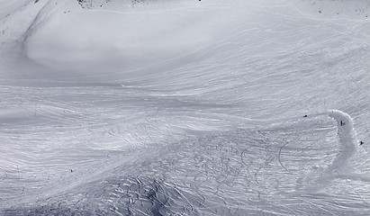 Image showing Skiers and snowboarders on off-piste slope in sun day