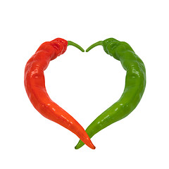 Image showing Red and green chili peppers in love