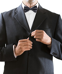 Image showing man clasps a jacket button