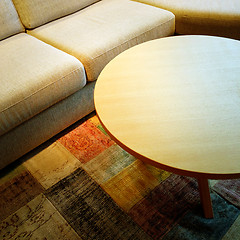 Image showing Sofa and coffee table on a colorful carpet