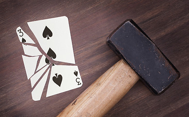 Image showing Hammer with a broken card, three of spades