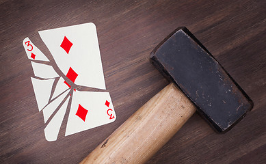 Image showing Hammer with a broken card, three of diamonds