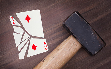 Image showing Hammer with a broken card, two of diamonds