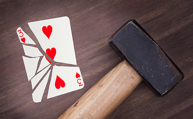 Image showing Hammer with a broken card, three of hearts