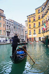 Image showing Gondola with tourists in water canal