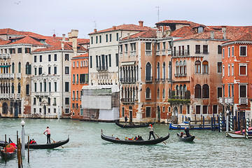Image showing Gondolas sailing through water canal in Venice