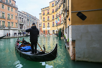 Image showing Gondola with tourists in Venice