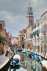 Image showing Gondolas moored along water canal in Venice