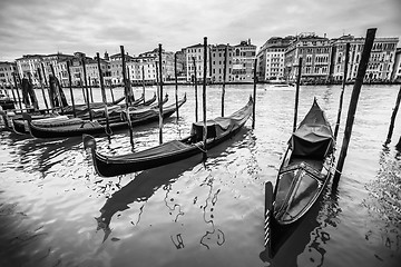 Image showing Gondola moored at dock in Venice