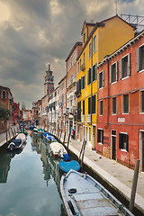 Image showing Gondolas moored in water canal