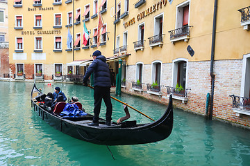 Image showing Gondola with tourists sailing in Venice