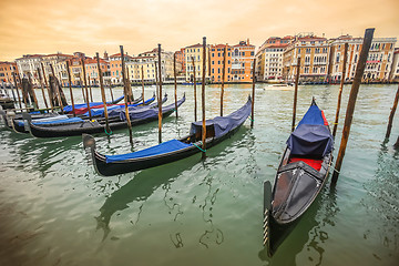 Image showing Gondolas moored at dock in Venice