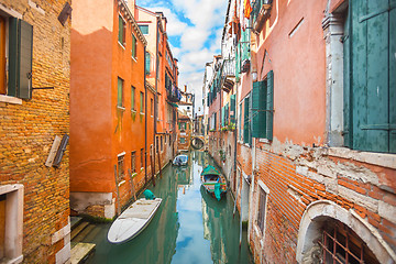 Image showing Gondolas parked next to buildings in Venice