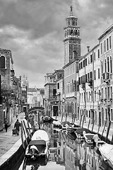 Image showing Gondolas moored along water canal bw