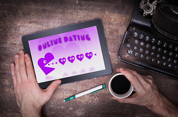 Image showing Online dating on a tablet