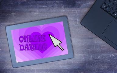 Image showing Online dating on a tablet