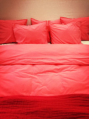 Image showing Bed with red romantic bed linen