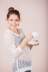 Image showing Woman with cup and saucer