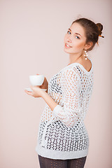 Image showing Woman with cup and saucer