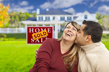 Image showing Mixed Race Couple in Front of Sold Real Estate Sign