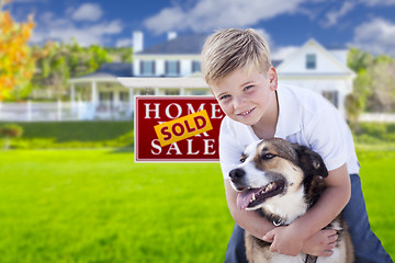 Image showing Boy and His Dog in Front of Sold Sign, House