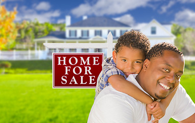Image showing Father and Son In Front of Sale Sign and House
