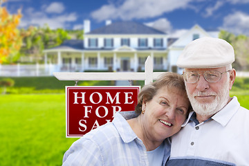 Image showing Happy Senior Couple Front of For Sale Sign and House