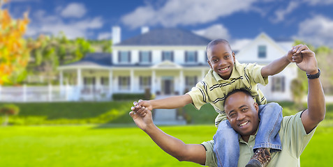 Image showing Playful African American Father and Son In Front of Home