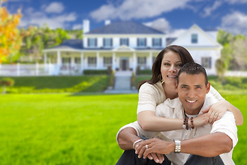 Image showing Happy Hispanic Young Couple in Front of Their New Home