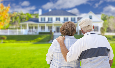 Image showing Happy Senior Couple Looking at Front of House