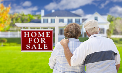 Image showing Happy Senior Couple Front of For Sale Sign and House