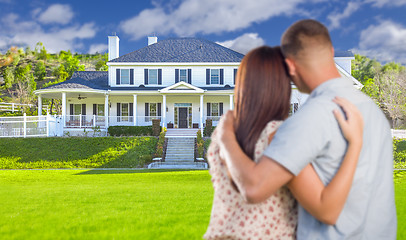 Image showing Military Couple Looking at Nice New House