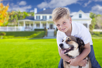 Image showing Young Boy and His Dog in Front of House