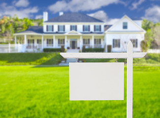 Image showing Blank Real Estate Sign in Front of New House 