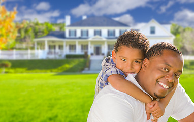 Image showing Mixed Race Father and Son In Front of House